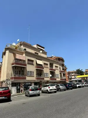 a building with cars parked on the side of a street at Casa Mapi in Rome
