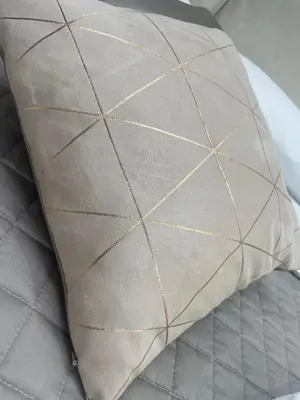 a pillow sitting on top of a bed at Bobbio Holiday Rome in Rome