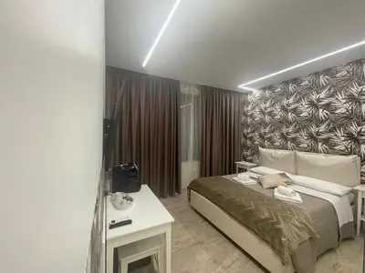 a hotel room with a bed and a table at Bobbio Holiday Rome in Rome