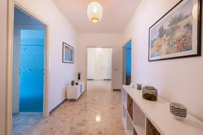 a room with a hallway with a large glass door at Casa Tripolitania in Rome