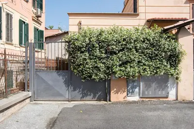 a large bush on the side of a building at Giardino al 9 in Rome