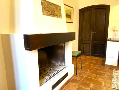 a living room with a fire place in the wall at Terraces under the Moon in Rome
