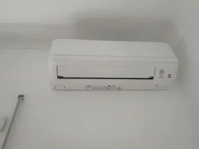 a white printer sitting on top of a wall at Roma SanPaolo Apartment in Rome