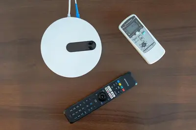 a computer mouse and a remote control on a table at Roma SanPaolo Apartment in Rome