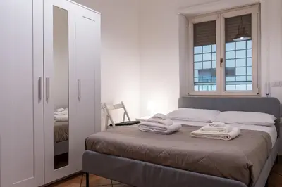 a bedroom with a bed with towels on it at Roma SanPaolo Apartment in Rome
