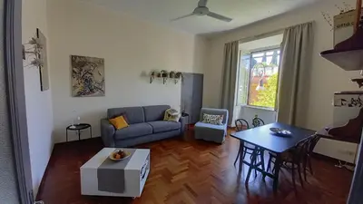 a living room with a couch and a table at Quiet in Biancamano - Metro A - San Giovanni - Centro Storico in Rome