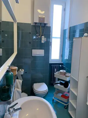 a bathroom with a toilet and a sink at Quiet in Biancamano - Metro A - San Giovanni - Centro Storico in Rome