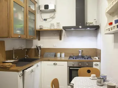 a kitchen with a sink and a stove top oven at Apartment Testaccio Piramide by Interhome in Rome