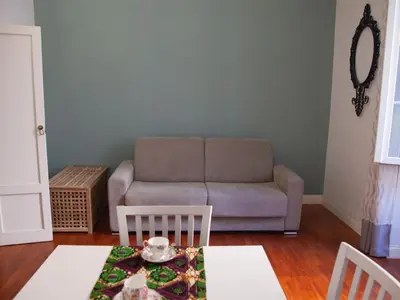a living room with a couch and a table at Apartment Testaccio Piramide by Interhome in Rome