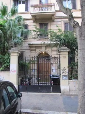 a building with a gate in front of it at ROMA your home in trastevere e gianicolo in Rome