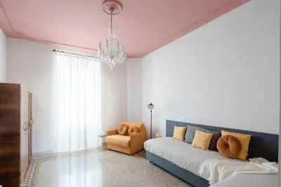 a living room with a couch and a chair at New apartment with amazing view of S Peter's Dome in Rome