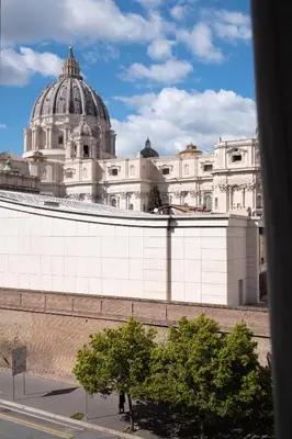 a large white building with a dome on top of it at New apartment with amazing view of S Peter's Dome in Rome