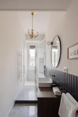 a bathroom with a sink and a mirror at New apartment with amazing view of S Peter's Dome in Rome