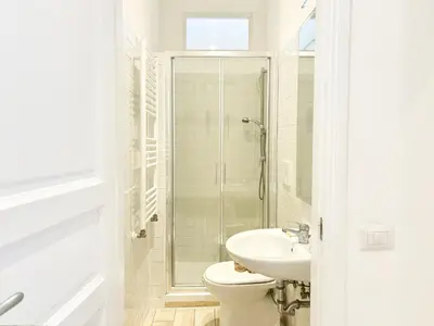 a white bathroom with a toilet and a sink at DaliTourism - Vatican Apartment 193 in Rome