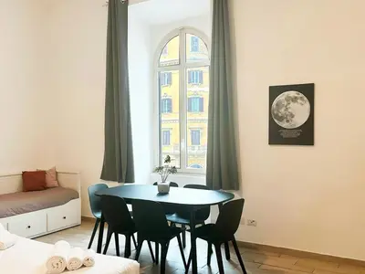 a room with a table and chairs and a window at DaliTourism - Vatican Apartment 193 in Rome