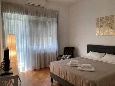 a bedroom with a bed with two towels on it at FAIROME Apartment 2 Pini in Rome