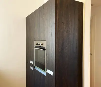 a wooden cabinet with an oven in it at Olmocolmo Trastevere in Rome