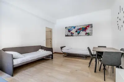 a living room with a couch and a table at Tiburtina White House in Rome