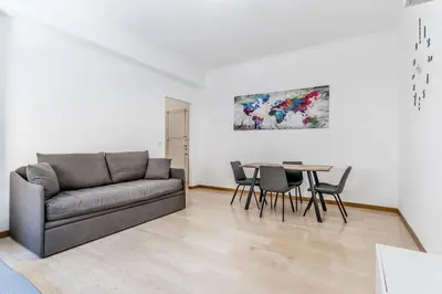 a living room with a couch and a table at Tiburtina White House in Rome