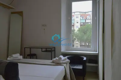 a hospital room with a bed and a window at Cozy Design Flat - Trastevere in Rome
