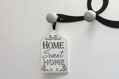 a house sweet home tag hanging on a wall at Amazing Via del Babuino - Piazza del Popolo in Rome