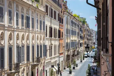a city street with buildings on either side at Amazing Via del Babuino - Piazza del Popolo in Rome