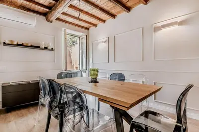 a white kitchen with a sink and a microwave at APT ROME - Vittoria Palace in Rome