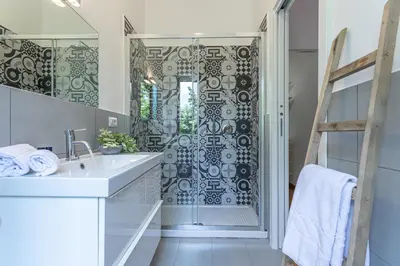 a bathroom with a sink and a shower at Minerva - Elegant New Classic close to Vatican in Rome
