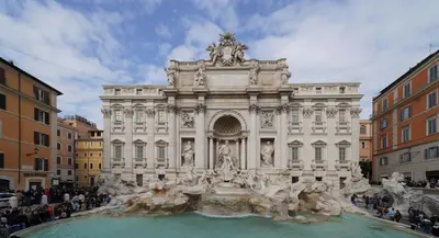 a large building with a fountain in front of it at Holiday Room Naiadis in Rome