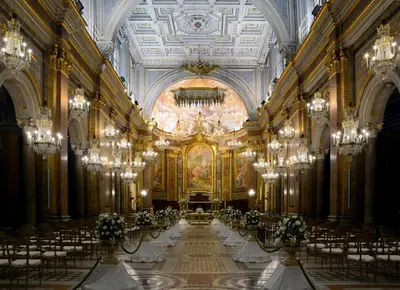 a large room with tables and chairs and a ceiling at Holiday Room Naiadis in Rome