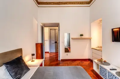a living room with a bed and a table at Corso Trieste 62 in Rome