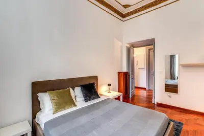 a bedroom with a large bed in a room at Corso Trieste 62 in Rome