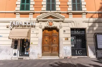 a building with a wooden door on a street at Corso Trieste 62 in Rome