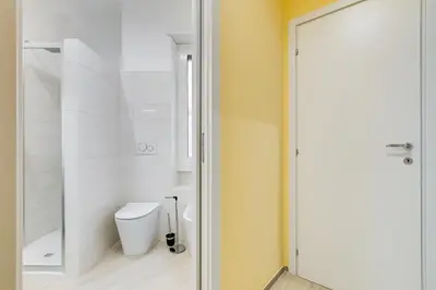 a bathroom with a toilet and a shower at Monteverde Cozy Apartment in Rome