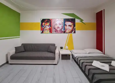 a room with two beds and a couch at APT Re di Roma in Rome