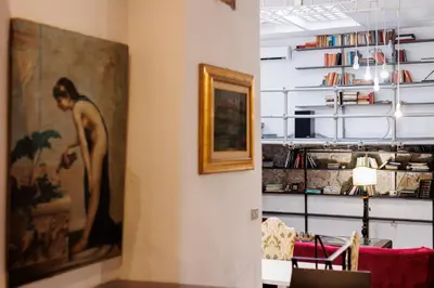 a room with a painting of a woman on the wall at Navona Glamour Apartment in Rome