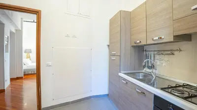 a kitchen with a sink and a counter top at EasyTopStay - Piazza Navona Elegant Apartment in Rome