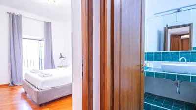 a bathroom with a sink and a mirror at EasyTopStay - Piazza Navona Elegant Apartment in Rome
