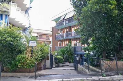 an apartment building with a walkway in front of it at Villa Bonelli Loft in Rome