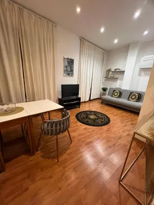 a living room with a table and a couch at PARIOLI LUXURY HoME in Rome