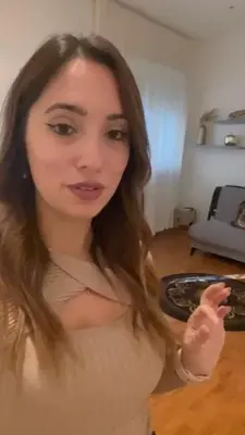 a young woman is pointing at the camera at PARIOLI LUXURY HoME in Rome