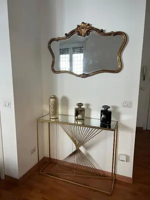 a glass table with a mirror on a wall at PARIOLI LUXURY HoME in Rome