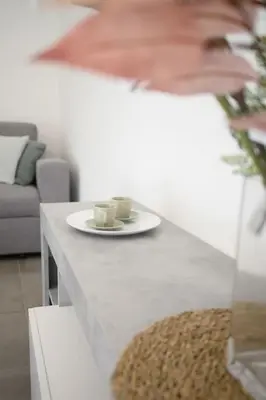 a table with a plate and two cups on it at Laura Sweet Home con Piscina in Rome