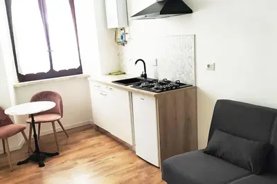 a kitchen with a sink and a stove top oven at Appartamento a due passi da San Pietro, Vaticano in Rome