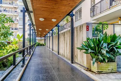 a corridor of a building with plants on the side at Garbatella Elegant Apartment in Rome