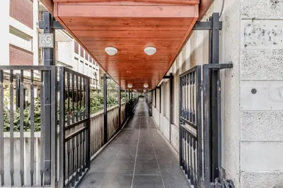 a hallway of a building with a wooden ceiling at Garbatella Elegant Apartment in Rome