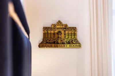 a sign on a wall that says carver luxury rooms at Cavour LR Collection in Rome