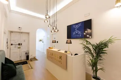 a room with a counter with a sign on the wall at Cavour LR Collection in Rome