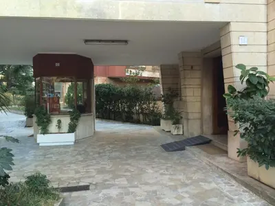 an entrance to a building with potted plants at Arches Inn in Rome