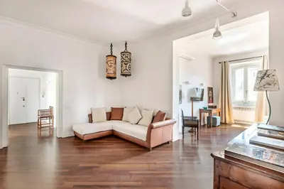 a living room with a couch and a table at Relais Quinto Piano in Rome